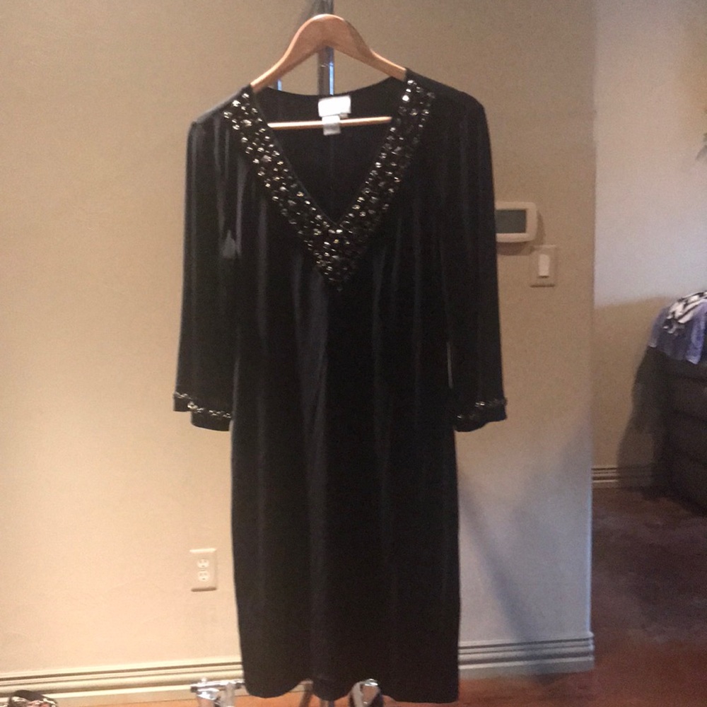 Black dress with gold stones along neckline